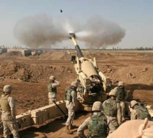 HEAVY FIRE POWER WAS USED IN FALLUJAH IN 2004: U.S. Marines fire Nov. 11, 2004, on Fallujah with a 155 mm Howitzer.